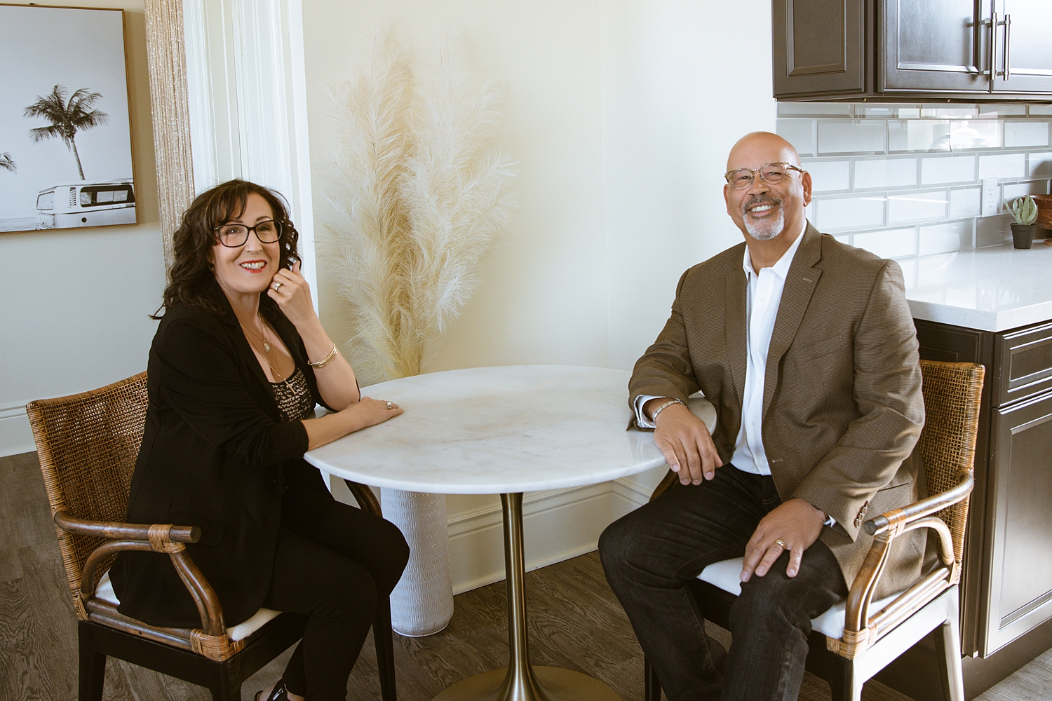 George and Dawn Guillory seated at a table in a remodeled kitchen
